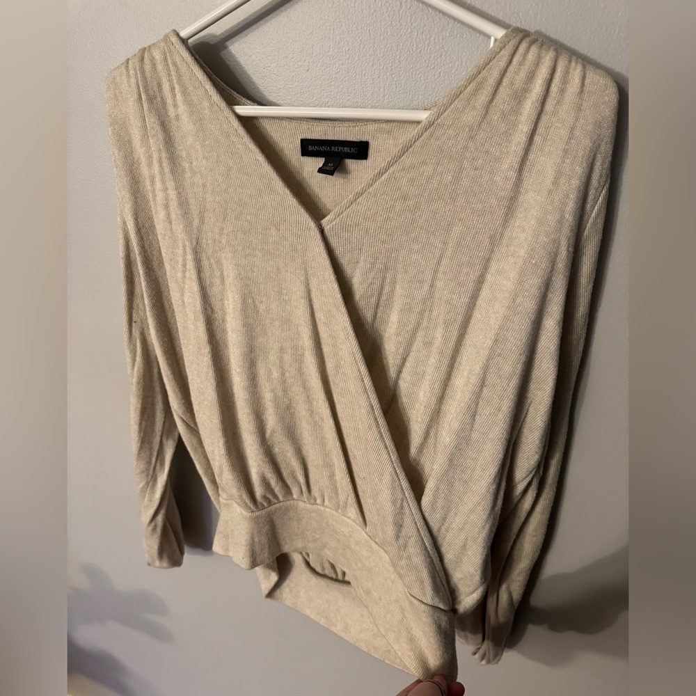 Long sleeved cream colored sweater